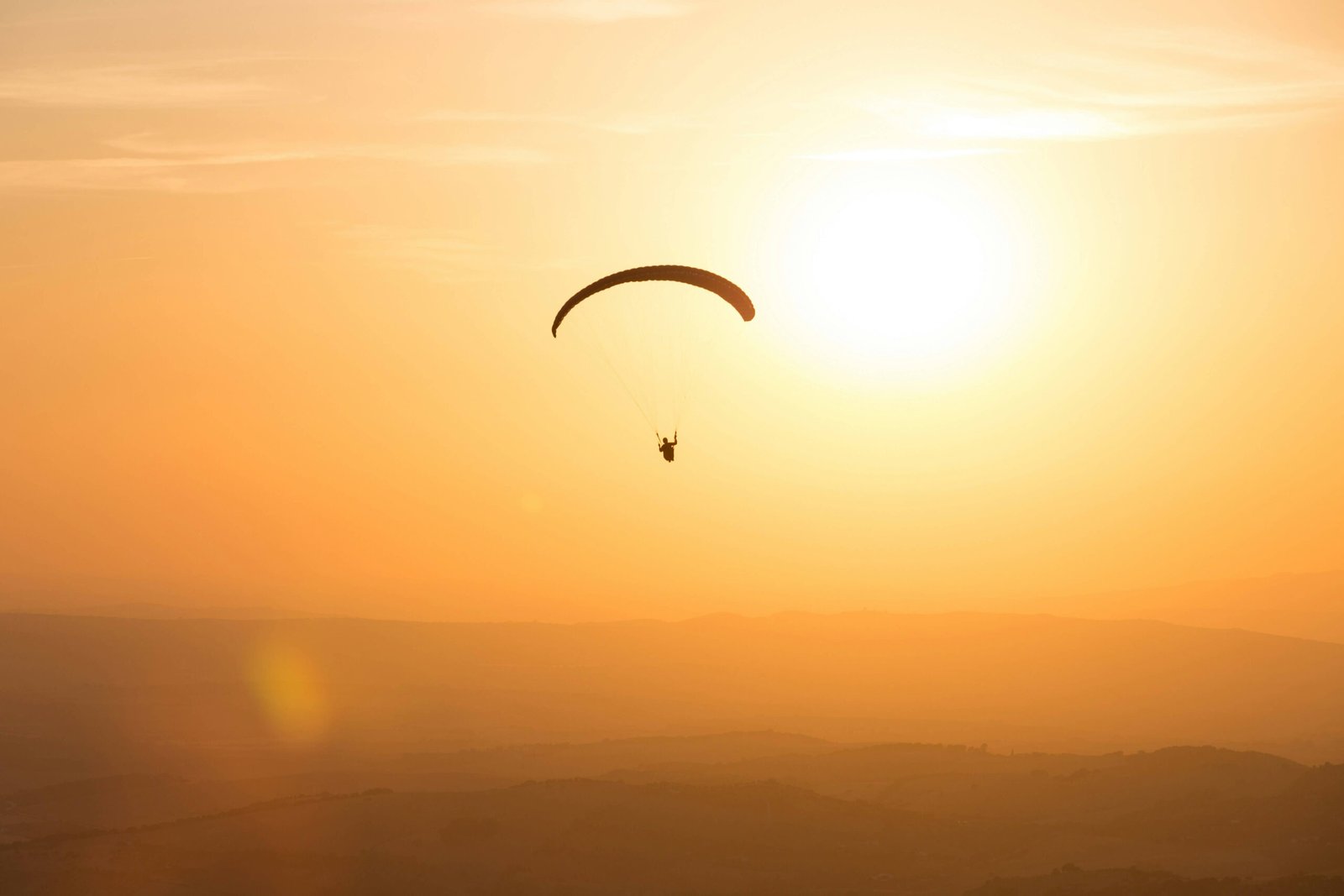 Sunset paragliding flight