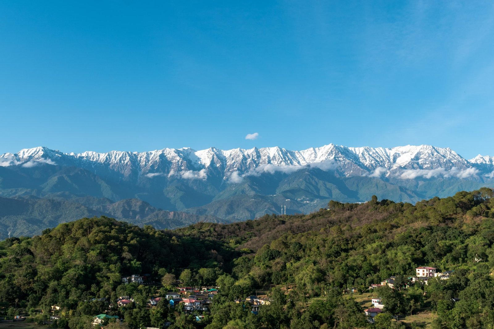 Layered mountain ridges seen from Bir beneath a clear sky